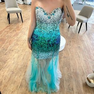 Size 12 Nina Canacci prom dress. Different shades of blue and silver sequins